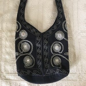 Black and white embroidered bag with mirrors